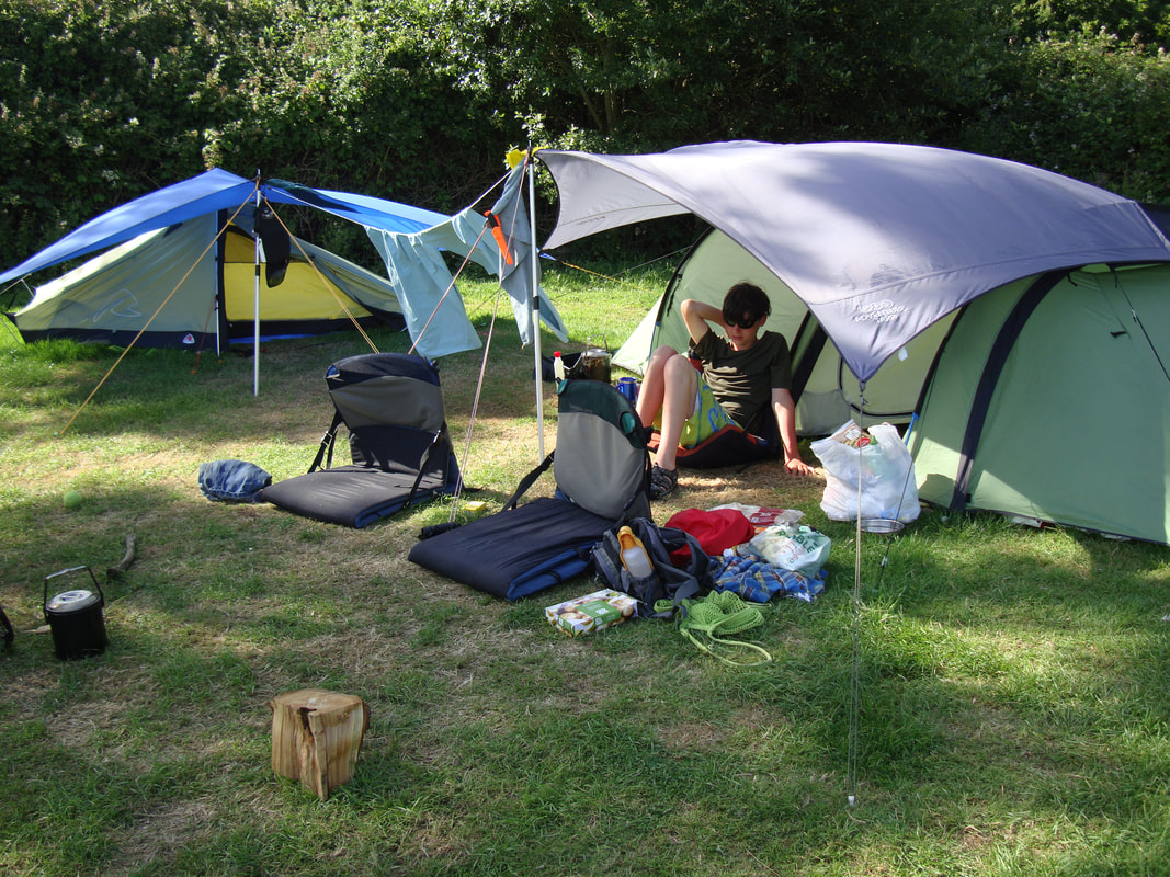Camping at Harmans Cross Campsite - two backpacking tents set up on top of a hill